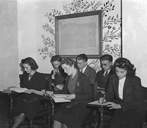 A photo of students in the 1930s taking a test.