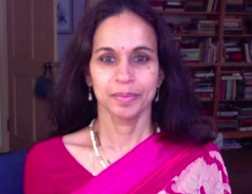 Uma Satyavolu, brown woman dressed in pink sari